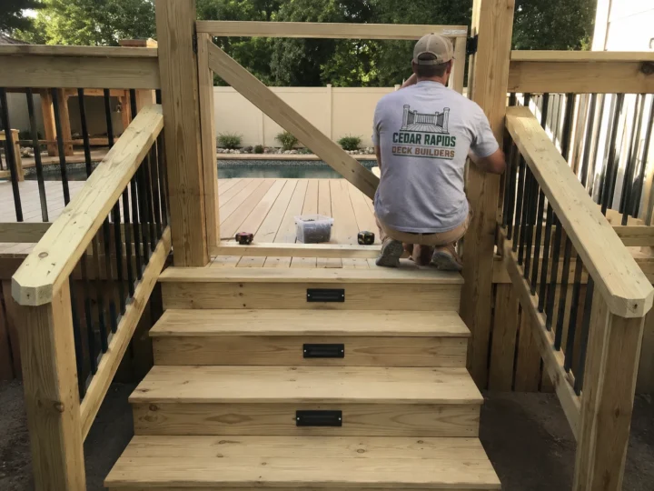 Building wide deck staircase in Central City, Iowa