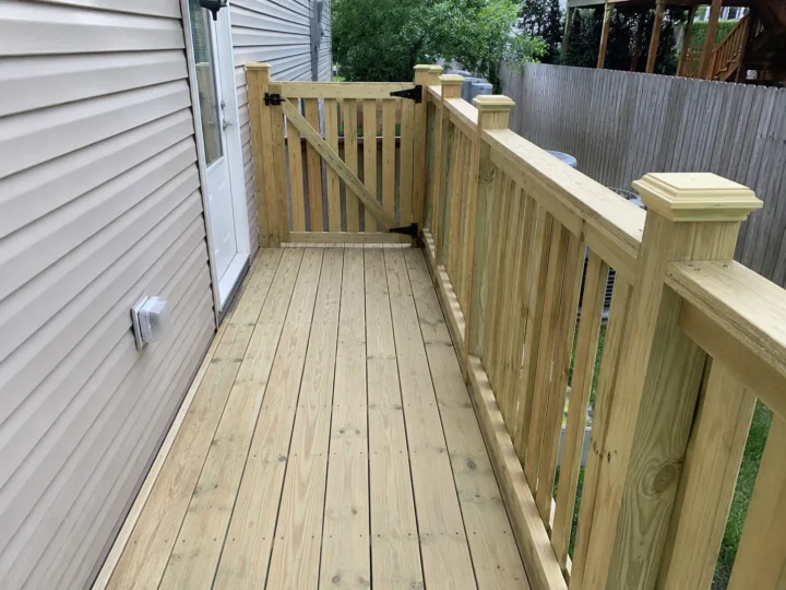 Narrow pressure treated side deck walkway in Ely, Iowa