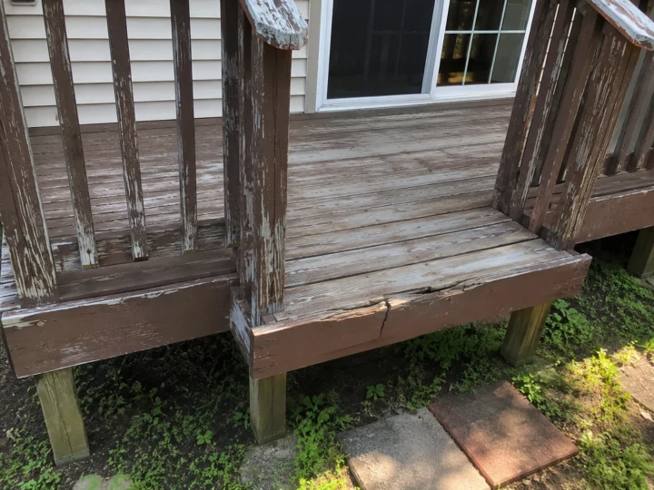 Weathered side deck and stairs in Ely, Iowa