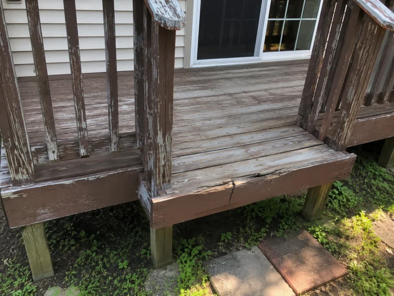 Weathered side deck and stairs in Ely, Iowa