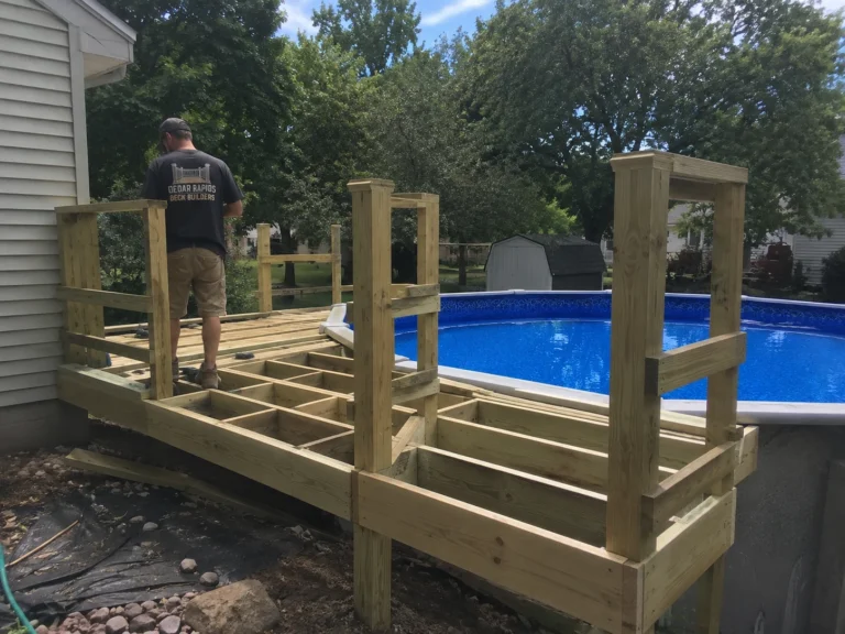 Framing pool deck with railing posts in Lisbon, Iowa
