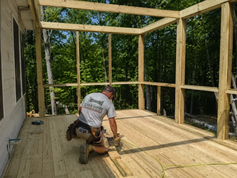 Deck and screened porch framing with structural members visible