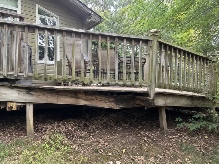Weathered wood deck needing replacement in Springville, Iowa