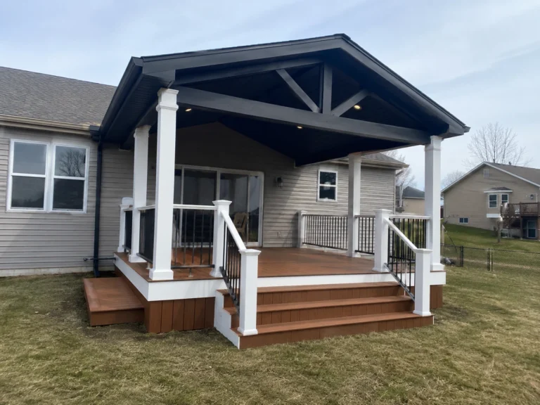 White covered porch with dark gable in Van Horne, Iowa